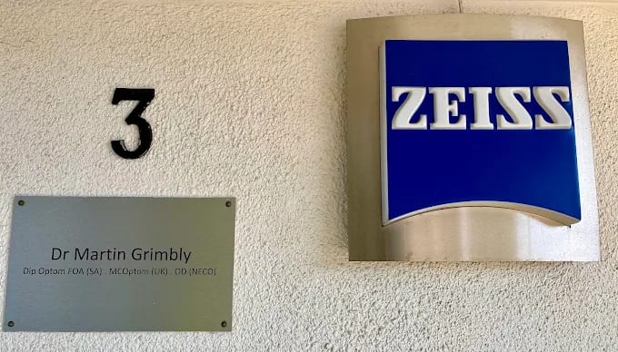Dr Martin Grimbly nameplate and ZEISS Vision Centre plaque